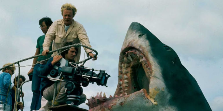 Steven Spielberg pointing the camera to the inside of the shark's mouth on the set of Jaws.