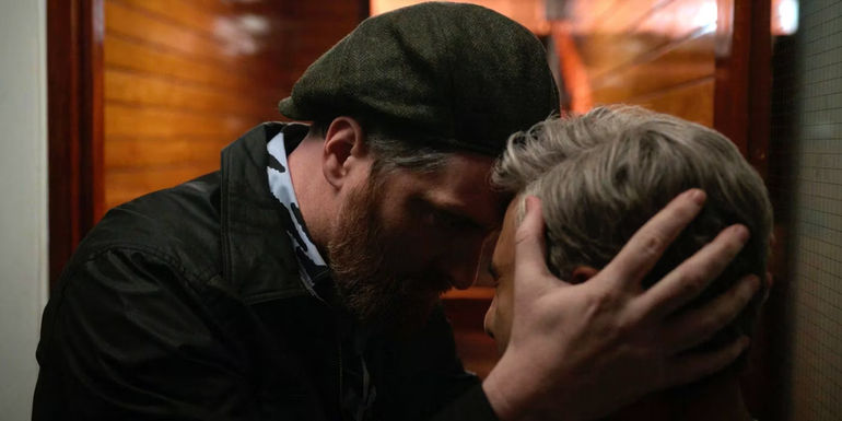 Beard (Brendan Hunt) forgivingly holding Nate's (Nick Mohammed) head in Ted Lasso, 