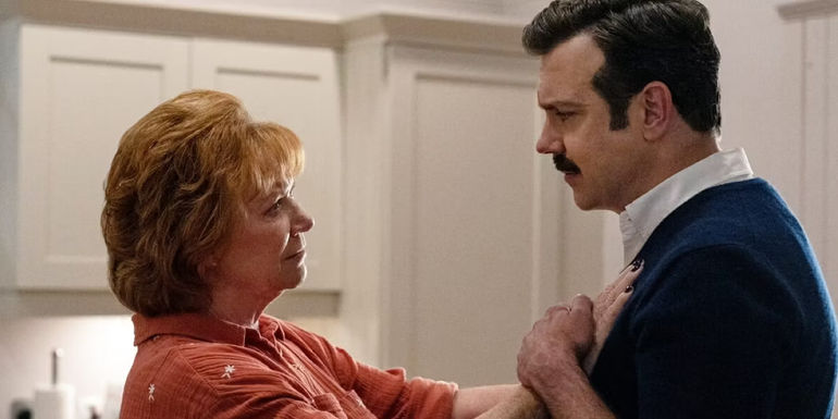 Ted (Jason Sudeikis) breaking down to his mother Dottie (Becky Ann Baker) in Ted Lasso, 