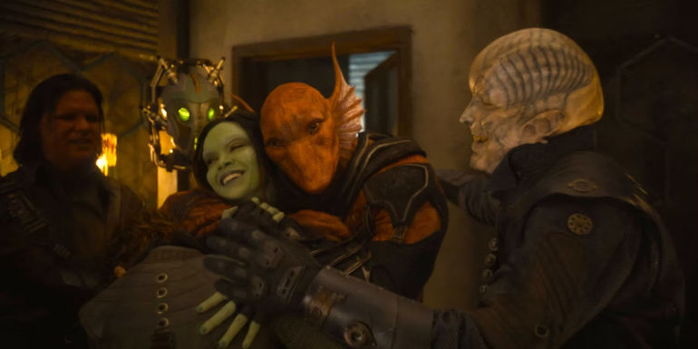 Zoe Saldana as Gamora being hugged by Ravagers in Guardians of the Galaxy Vol. 3 (2023)
