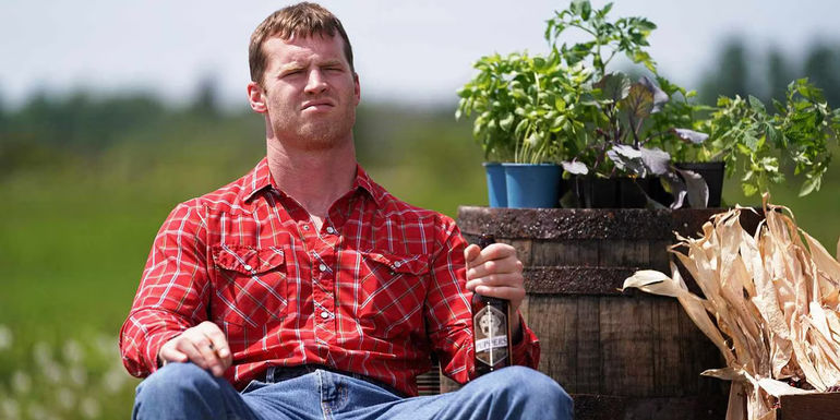 Wayne (Jared Keeso) sitting with a drink in Letterkenny