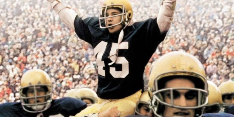 Rudy being carried off the field