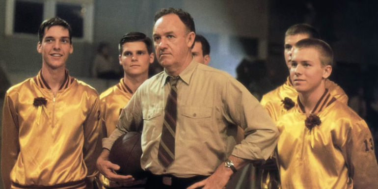 Gene Hackman surrounded by his basketball team in Hoosiers