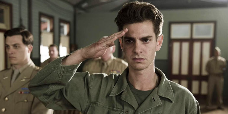 Andrew Garfield as Private Desmond Doss saluting in the movie Hacksaw Ridge.