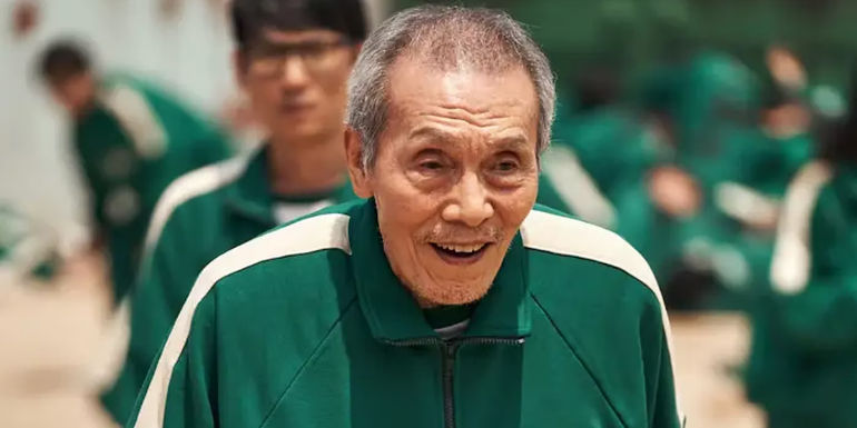 II-Nam with a smile on his face in Squid Games.