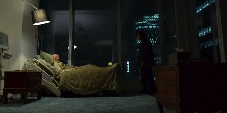 II-Nam laying in a hospital bed over looking the city in Squid Games.