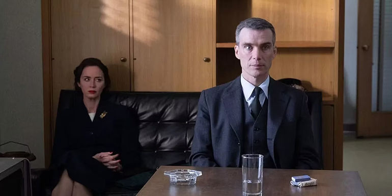 Kitty sitting behind Oppenheimer at his hearing in Oppenheimer 