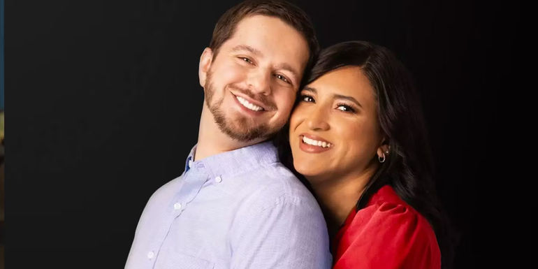 Anali and Clayton from 90 Day Fiance cuddling for the camera and smiling in a promo shot