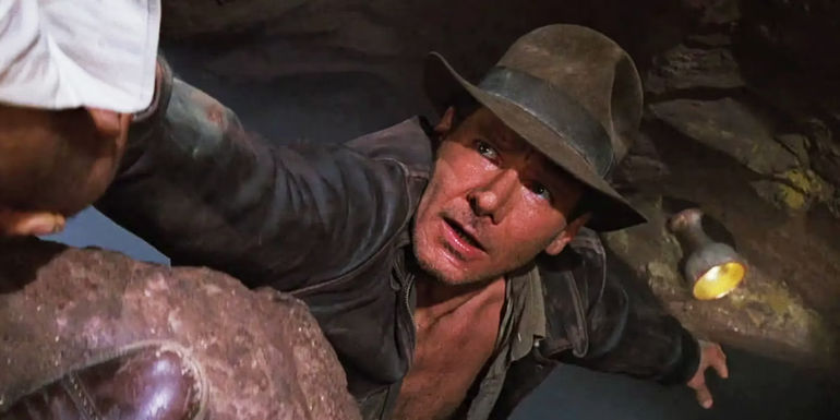 Harrison Ford as Indy reaching for the Holy Grail in Indiana Jones and the Last Crusade.