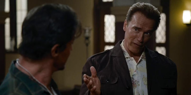 Arnold Schwarzenegger talking to Sylvester Stallone in The Expendables