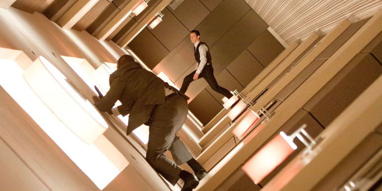 Joseph Gordon-Levitt as Arthur fighting a henchman during Inception's rotating hallway scene.