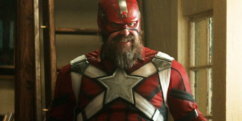 Red Guardian smiling in full uniform in Black Widow
