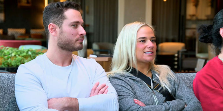 Emily and Brennan Married At first Sight season 17 sitting next to eachother with arms crossed