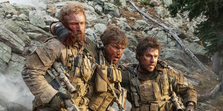 Mark Wahlberg and Ben Foster helping Emile Hirsch in Lone Survivor 