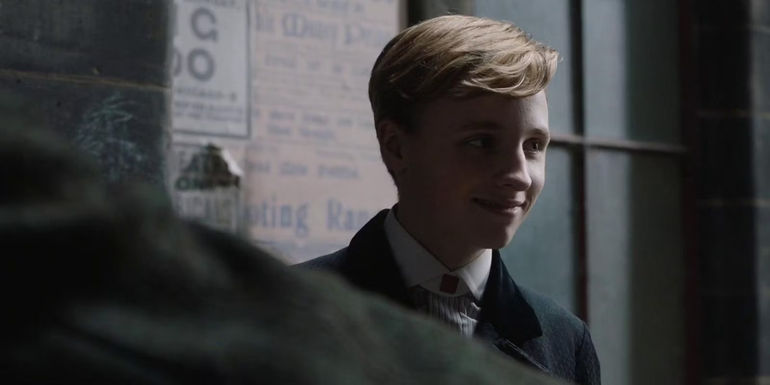 Ty Tennant smiling in an alley in Tolkien 