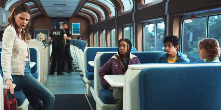 Echidna standing across Annabeth, Grover, and Percy on a train in Percy Jackson & The Olympians