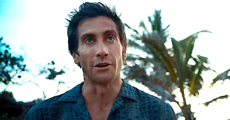 Jake Gyllenhaal on a beach talking in a scene from Road House