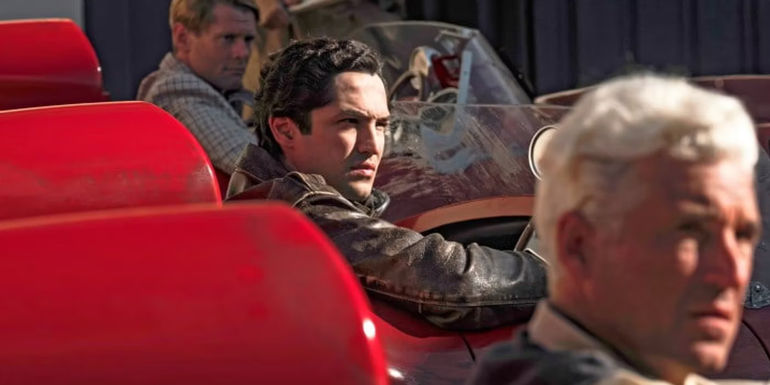 Gabriel Leone as Alfonso de Portago inside a car in Ferrari