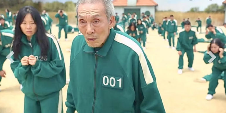 II-Nam has a serious look on his face while playing red light green light in Squid Games.