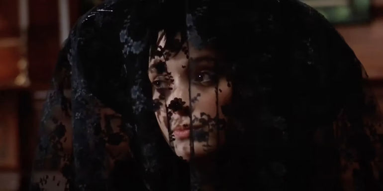 Lydia with a cowl on in Beetlejuice