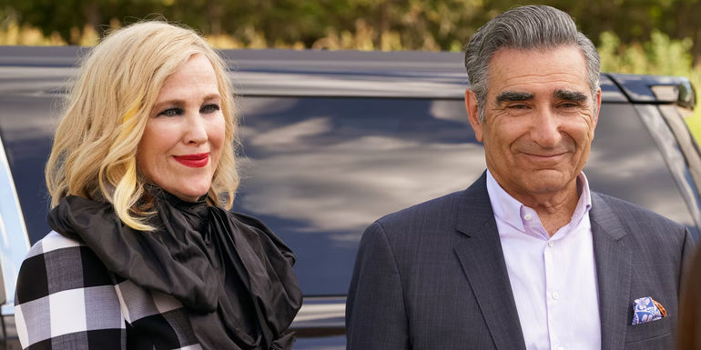 Johnny and Moira say goodbye to their kids outside in Schitt's Creek