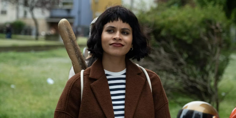 Zazie Beetz in character in Atlanta season 3 finale carrying a baguette in a backpack