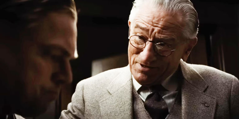 Robert De Niro as William Hale leaning toward Ernest in Killers of the Flower Moon