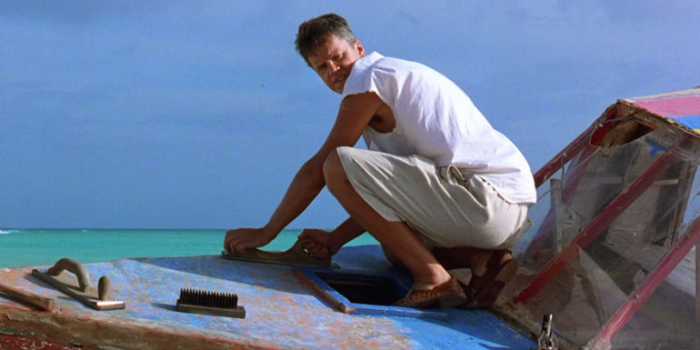Andy Dufresne working on boat in The Shawshank Redemption