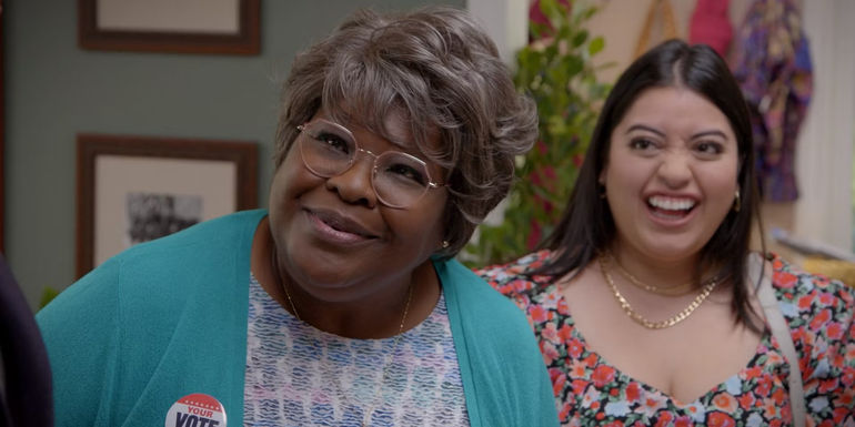 Auntie Rae smiling in Curb Your Enthusiasm