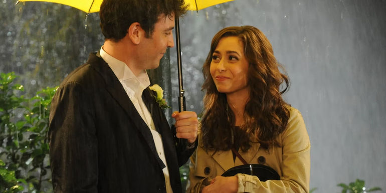 Josh Radnor as Ted Mosby and Cristin Milioti as Tracy McConnell smiling at each other with a yellow umbrella on How I Met Your Mother