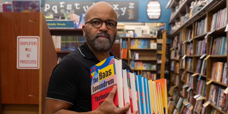 Jeffrey Wright holding books in a bookstore from American Fiction