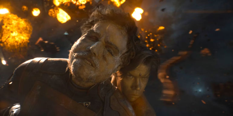 Chris Pratt as Star-Lord being rescued by Will Poulter as Adam Warlock in Guardians of the Galaxy Vol. 3