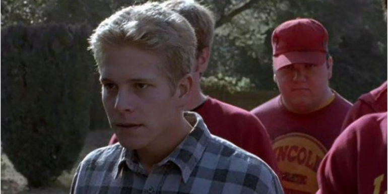 A Lincoln High School student (matt czuchry) standing with his gang looking angry in Freaks and Geeks.