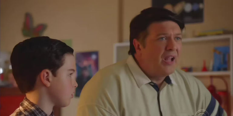 Lance Barber's George Cooper looks shocked beside Iain Armitage's Sheldon in Young Sheldon.
