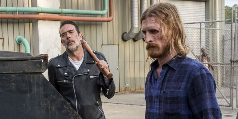 Dwight looking guilty, Negan staring him down whole holding his bat in a scene from The Walking Dead.