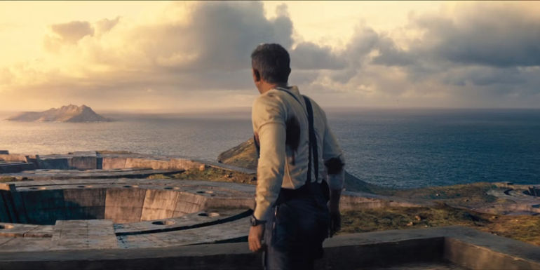 Daniel Craig's James Bond with his back to the camera on Safin's island in No Time to Die.