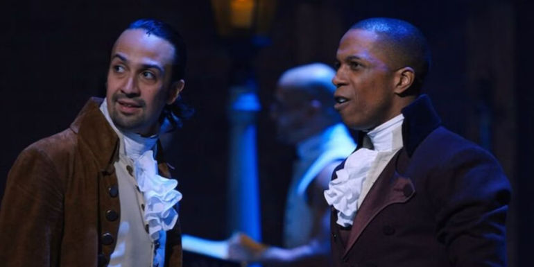 Hamilton looks away from Aaron Burr in the Hamilton stage show