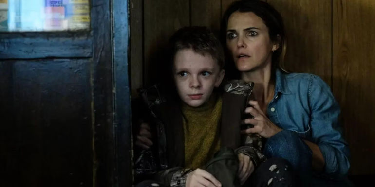 Main characters in the movie Antlers hide from a Wendigo