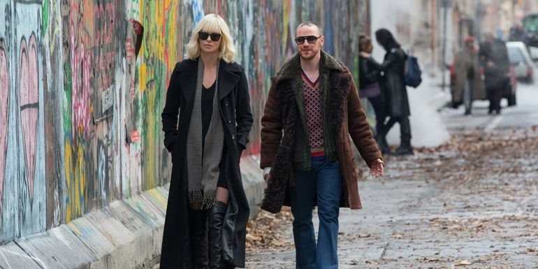Lorraine and David walking together in Atomic Blonde.