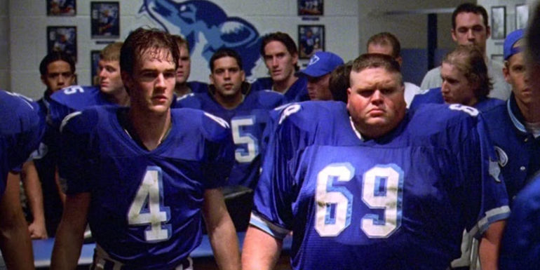 Mox (James Van Der Beek) and the rest of the football team leaving the locker room in Varsity Blues.
