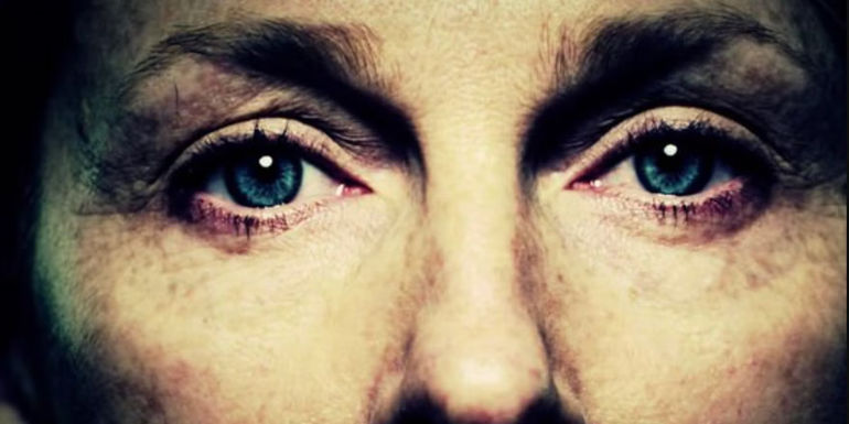 The eyes of Piper Kerman in the Orange is the New Black title sequence
