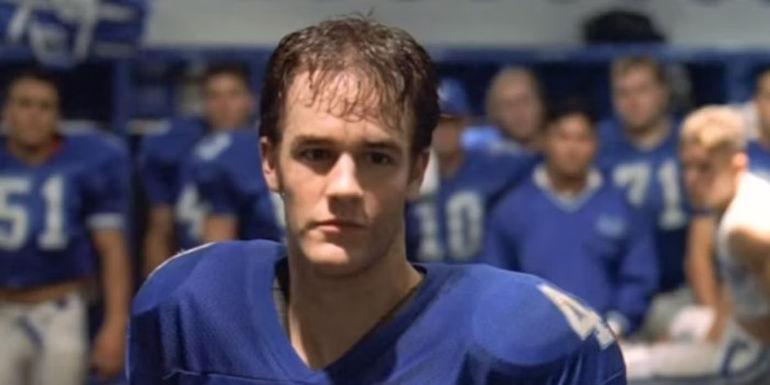 James Van Deer Beek as Mox looking sad in his uniform in Varsity Blues