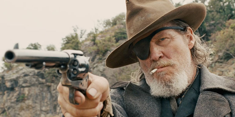 Jeff Bridges with a pistol in True Grit