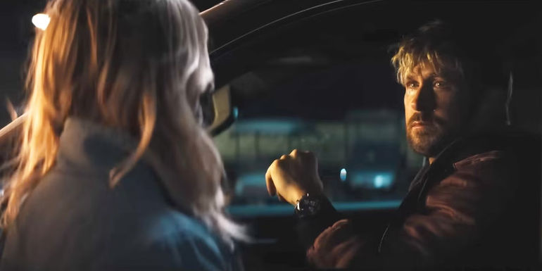 Ryan Gosling sits in his car and looks at Emily Blunt in The Fall Guy.