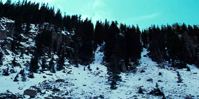 Snowy forest mountain landscape in Seraphim Falls.