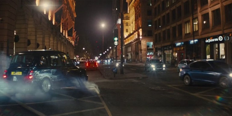 A London taxi skidding through a cloud of smoke in Kingsman: The Golden Circle