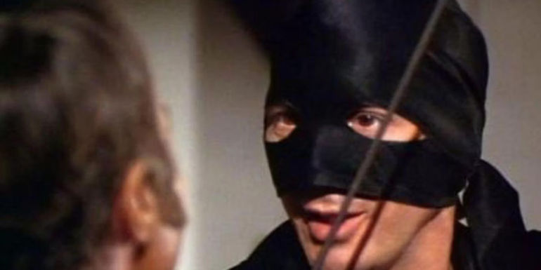 Frank Langella wearing Zorro's mask and looking sideways in The Mark of Zorro