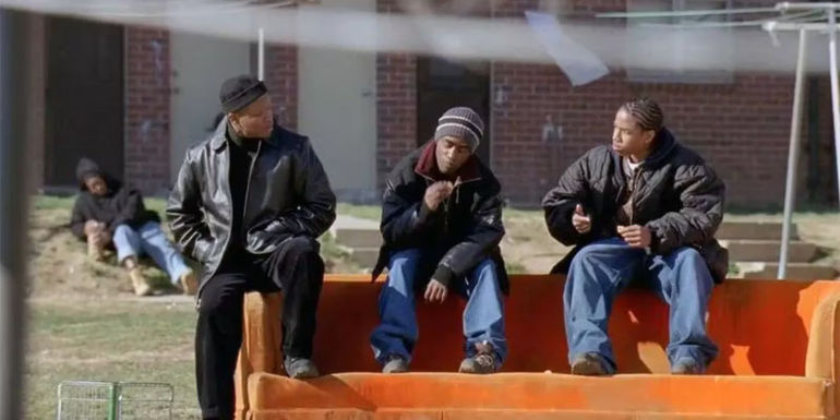 Lawrence Gilliard Jr. as D'Angelo Barksdale, Tray Chaney as Poot, and Michael B. Jordan as Wallace hang out in the Low Rises in The Wire.