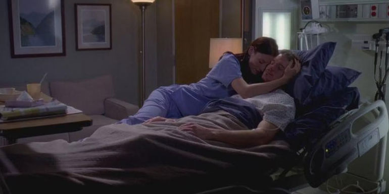 Lexie hugs Mark in a hospital bed Grey's Anatomy