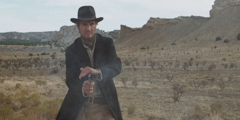 Carver (Liam Neeson) holding the hammer of his revolver after shooting Hayes in Seraphim Falls